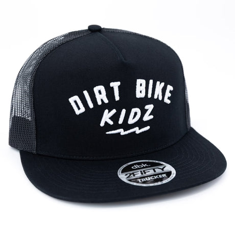 Black adult 12 O'Clock Trucker Hat with white embroidered Dirt Bike Kidz arch logo on structured front panel and black mesh back, DBK snapback closure