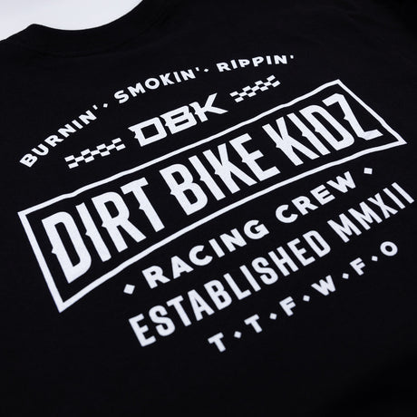 Speed & Style Tee close-up of bold back graphic: DBK banner and established MMXII