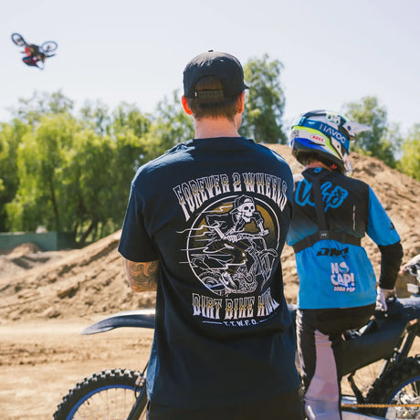 Ghost Rider Tee worn by model, navy, back view with Forever 2 Wheels Dirt Bike Kidz skull rider graphic