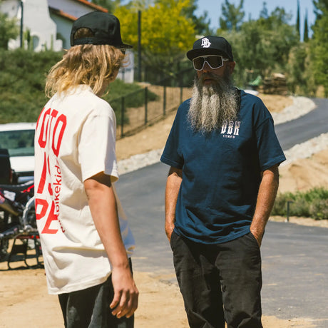 Ghost Rider Tee worn by model, navy, front view with small DBK chest logo