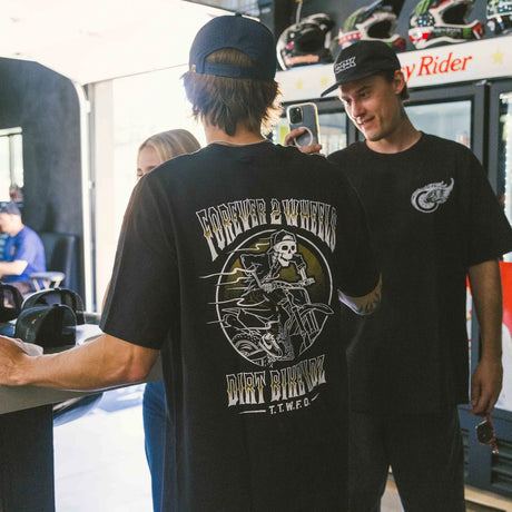 Dirt Bike Kidz Ghost Rider Tee worn by model, black, showing Forever 2 Wheels skull rider back graphic