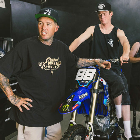 Black Gold Standard tee worn, front Dirt Bike Kidz logo graphic
